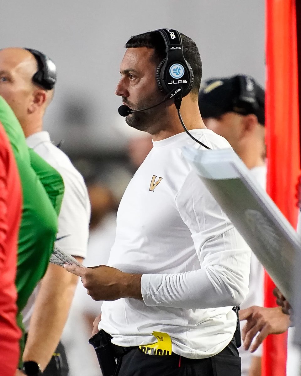 College football coach represented by Aura Sports Group