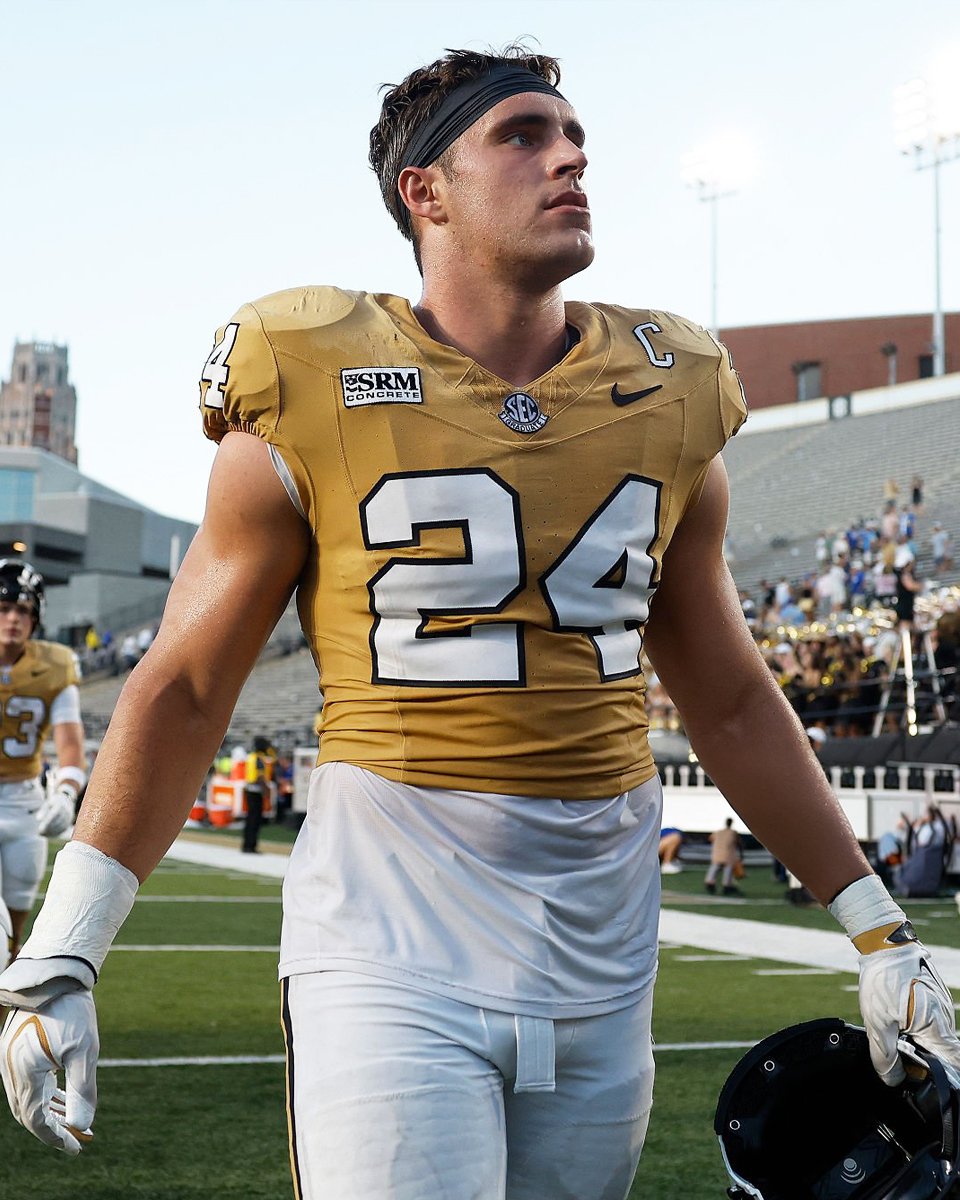 College football player walking off the field