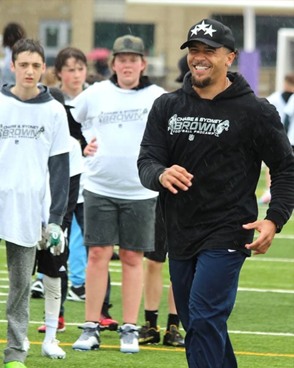 Aura Sports Group NFL client at a youth football camp